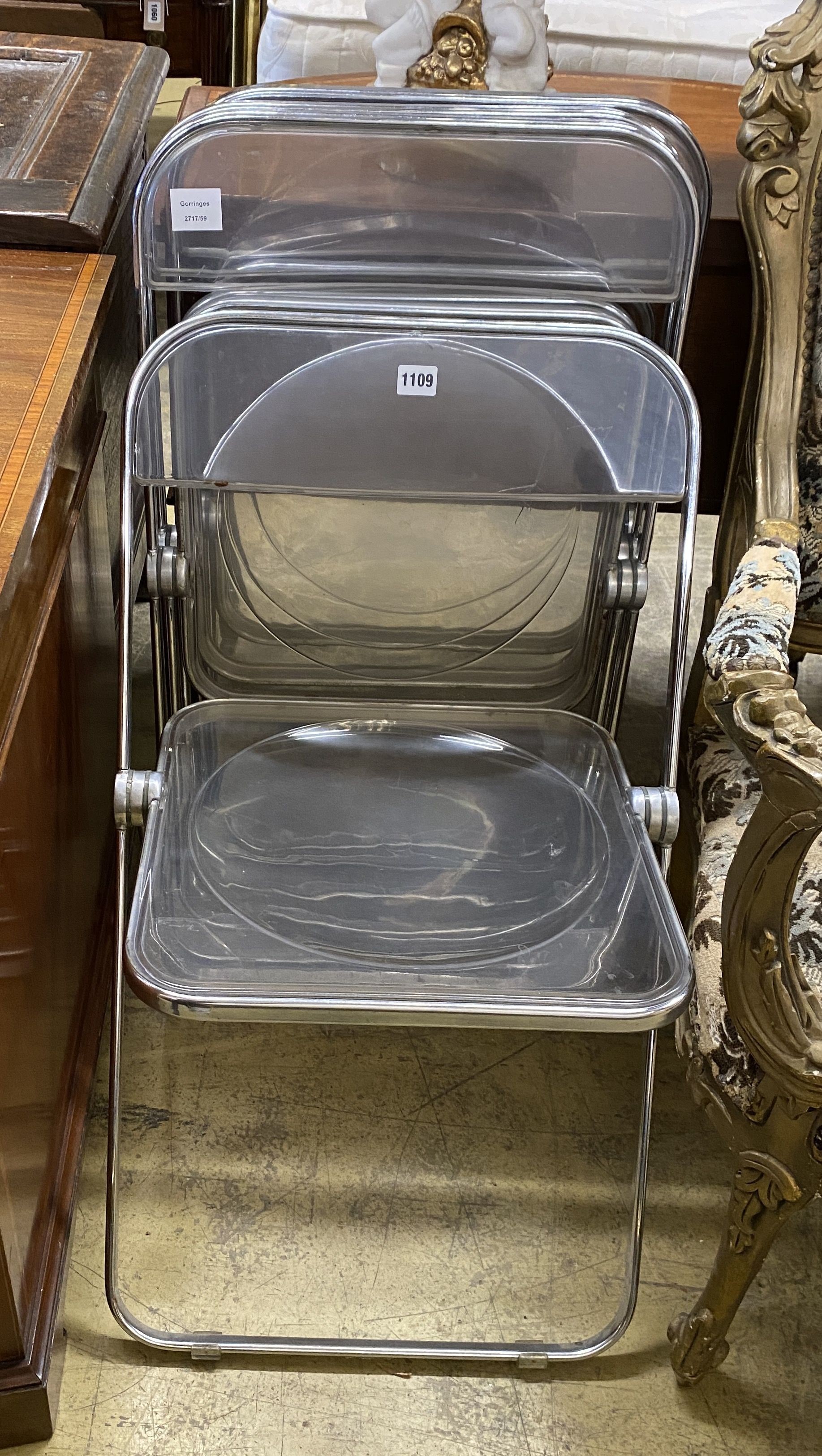 A set of four mid century chrome and perspex folding chairs